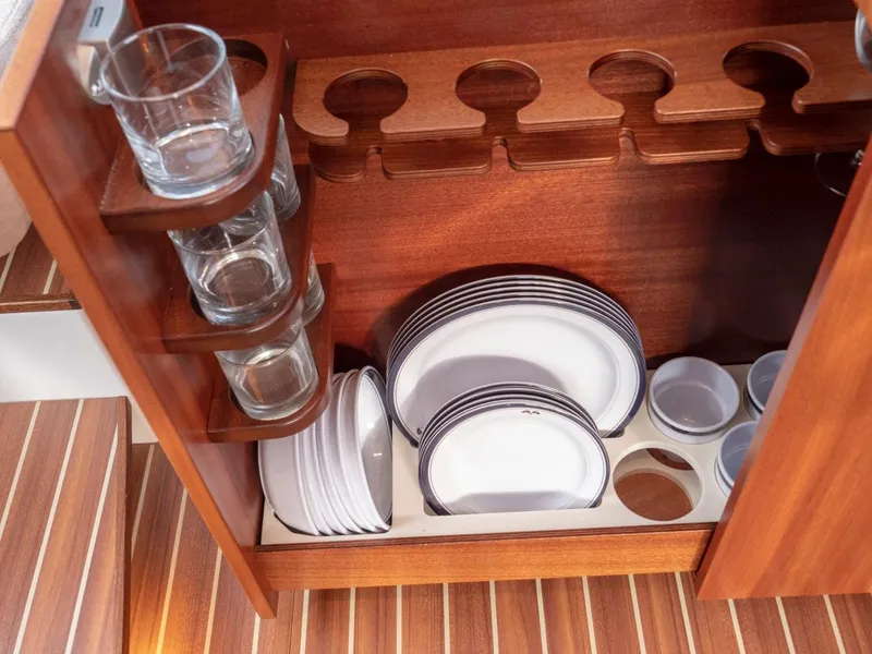 Slide: The Image of Wooden cabinet with glassware and plates on a Nimbus 405 Flybridge, 2017 model. - 32