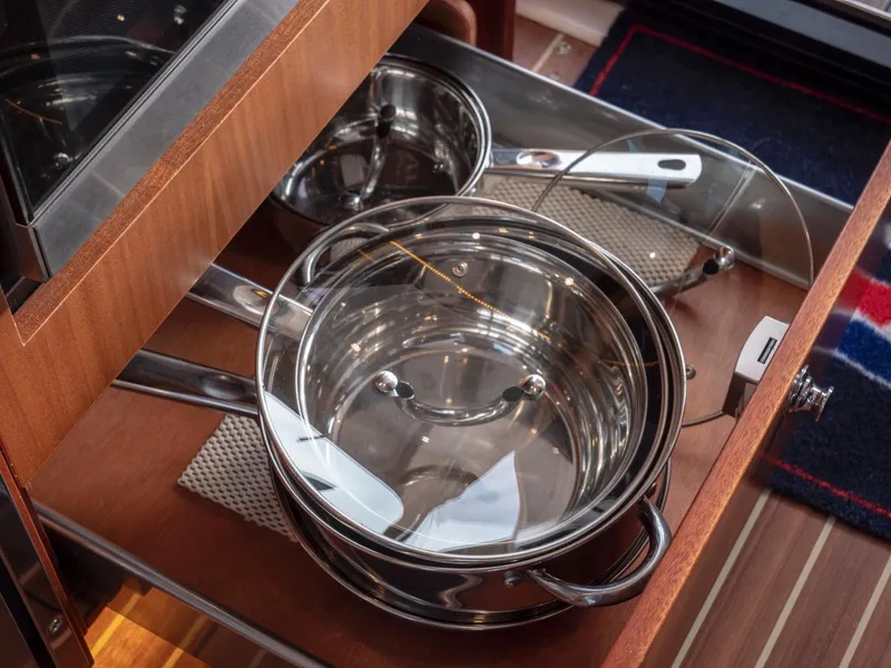 Slide: The Image of Stainless steel pots in a wooden drawer on a 2017 Nimbus 405 Flybridge yacht. - 33