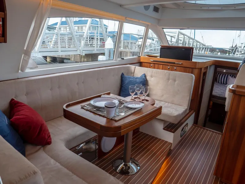 Slide: The Image of Luxurious interior of 2017 Nimbus 405 Flybridge yacht with elegant dining area. - 37