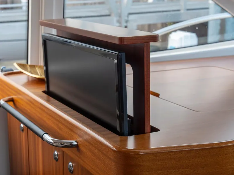 Slide: The Image of Pop-up TV on Nimbus 405 Flybridge yacht, 2017 model, with elegant wooden cabinetry. - 40