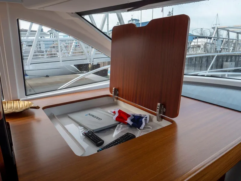 Slide: The Image of Interior of 2017 Nimbus 405 Flybridge yacht with storage compartment open. - 42