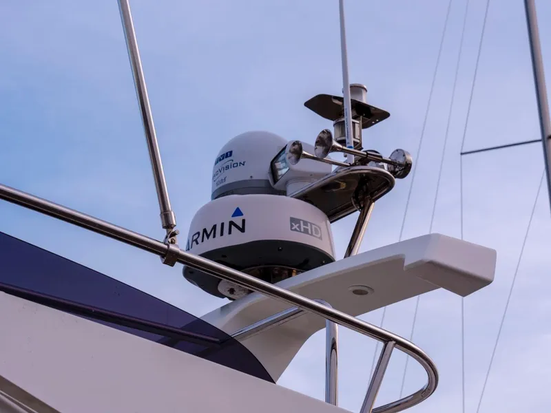 Slide: The Image of Radar equipment on 2017 Nimbus 405 Flybridge yacht against a clear sky. - 46