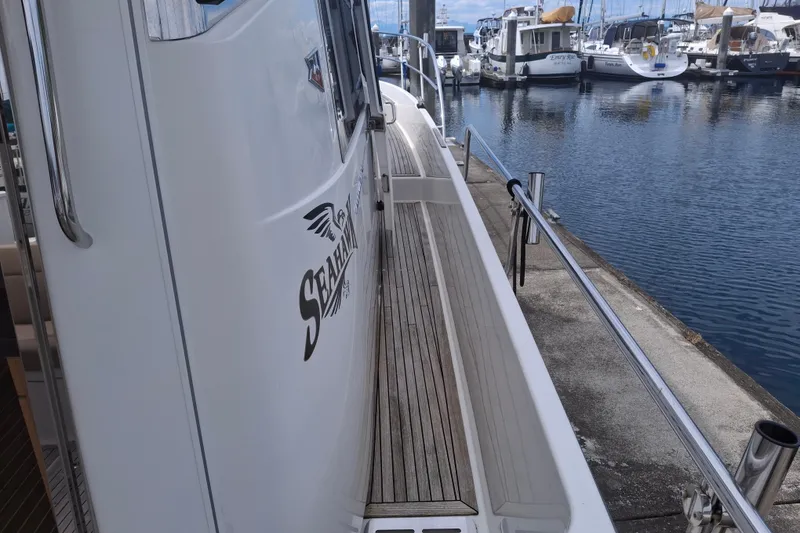 Slide: The Image of Side view of a 2017 Nimbus 405 Flybridge yacht docked at a marina. - 5