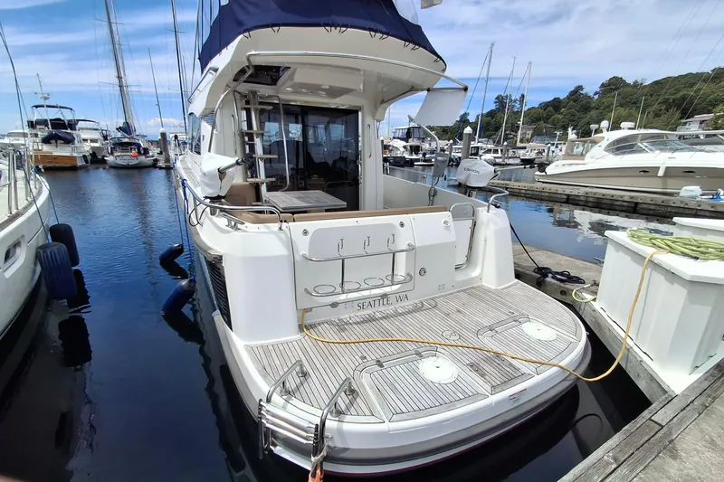 Slide: The Image of Nimbus 405 Flybridge 2017 yacht docked in marina, Seattle, WA, with scenic background. - 6