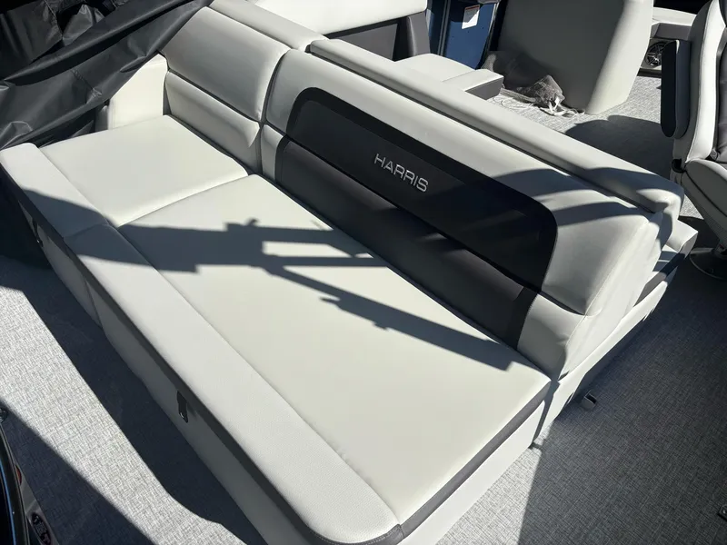Slide: The Image of 2025 Harris Cruiser 190 boat interior with sleek, modern seating design. - 5