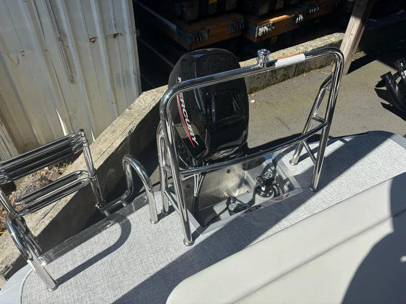 Slide: The Image of 2025 Harris Cruiser 190 boat with chrome railing and outboard motor. - 8