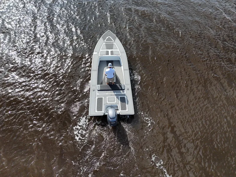 Slide: The Image of Overhead view of a 1996 Hewes 18 Redfisher boat on water. - 3