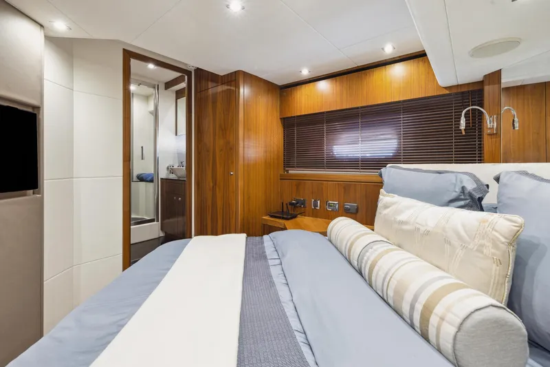 Slide: The Image of Luxurious bedroom interior of 2014 Sunseeker Manhattan 73 yacht with elegant wood paneling. - 31