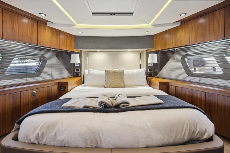 Slide: The Image of Luxurious bedroom interior of 2014 Sunseeker Manhattan 73 yacht with elegant wood paneling. - 35