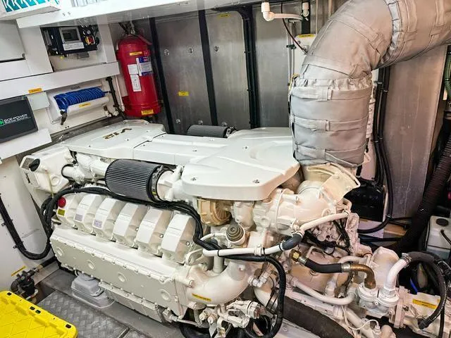 Slide: The Image of Engine room of 2014 Sunseeker Manhattan 73 yacht, featuring a powerful marine engine. - 40