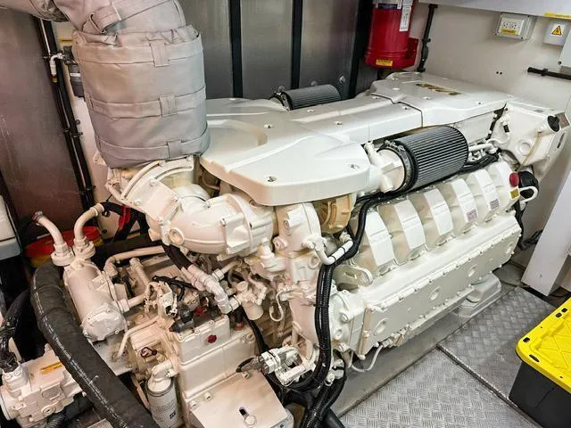 Slide: The Image of Engine room of 2014 Sunseeker Manhattan 73 yacht, showcasing powerful marine engine. - 41