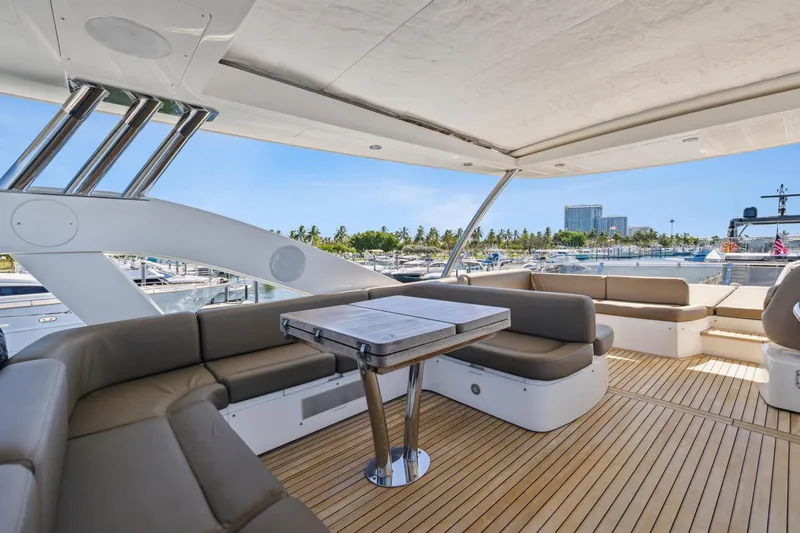 Slide: The Image of Luxurious Sunseeker Manhattan 73 yacht deck with seating, 2014 model, docked at marina. - 9
