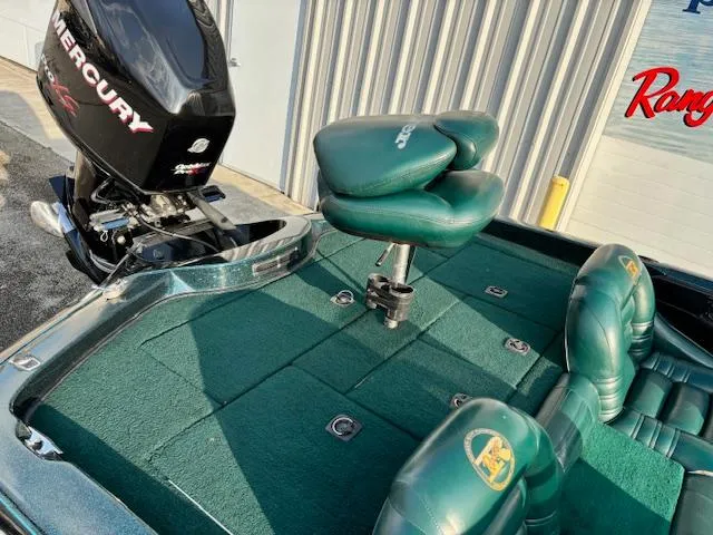 Slide: The Image of 1998 Ranger 518DVX boat with Mercury engine and green seating. - 12