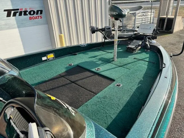 Slide: The Image of 1998 Ranger 518DVX boat deck with fishing equipment, near Triton Boats facility. - 7