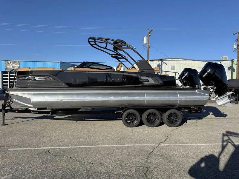 Slide: The Image of 2025 Avalon 2585 27-3 Excalibur LTD QL pontoon boat on trailer, side view. - 1