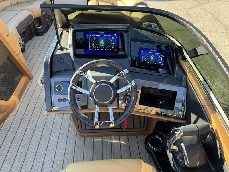 Slide: The Image of 2025 Avalon 2585 27-3 Excalibur LTD QL boat dashboard with modern controls and displays. - 10