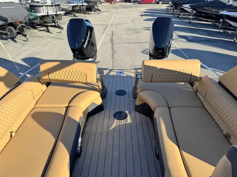 Slide: The Image of Luxurious Avalon 2585 27-3 Excalibur LTD QL 2025 boat with tan seating and dual engines. - 12