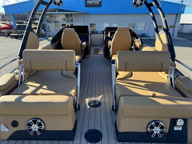 Slide: The Image of Luxurious 2025 Avalon 2585 Excalibur LTD QL boat interior with tan seating and modern design. - 3