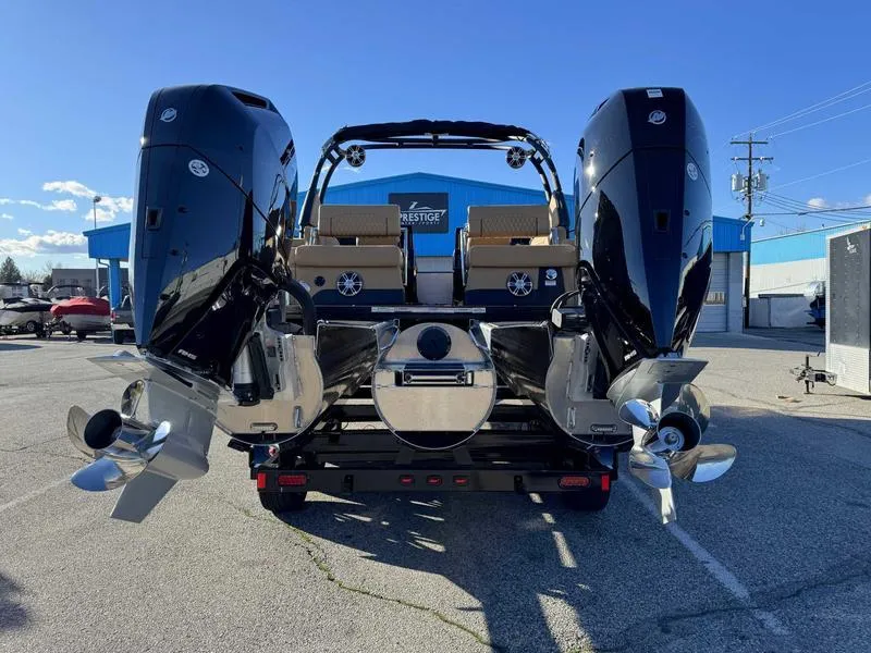 Slide: The Image of 2025 Avalon 2585 27-3 Excalibur LTD QL boat with dual engines, parked outdoors. - 6