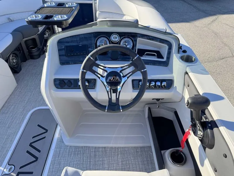 Slide: The Image of 2025 Avalon 2385 25 LSZ QL boat dashboard with steering wheel and controls. - 11