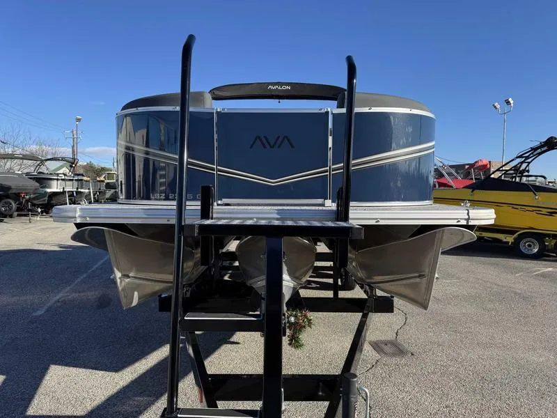 Slide: The Image of 2025 Avalon 2385 25 LSZ QL pontoon boat, front view, in a marina setting. - 4