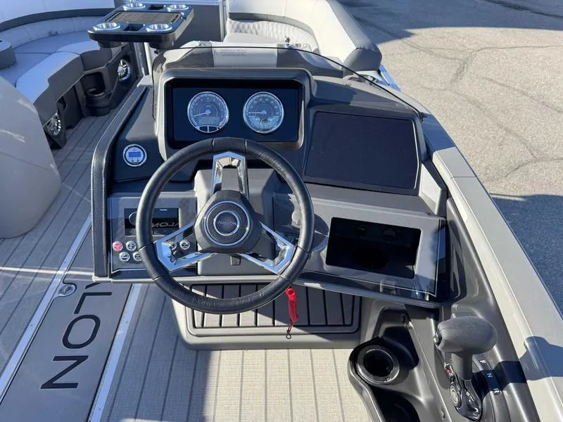 Slide: The Image of Steering console of 2025 Avalon 2385 25 Catalina VRB boat, featuring modern controls and gauges. - 10