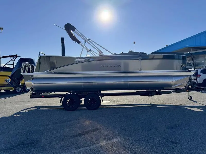 Slide: The Image of 2025 Avalon 2385 25 Catalina VRB pontoon boat on trailer under clear sky. - 5