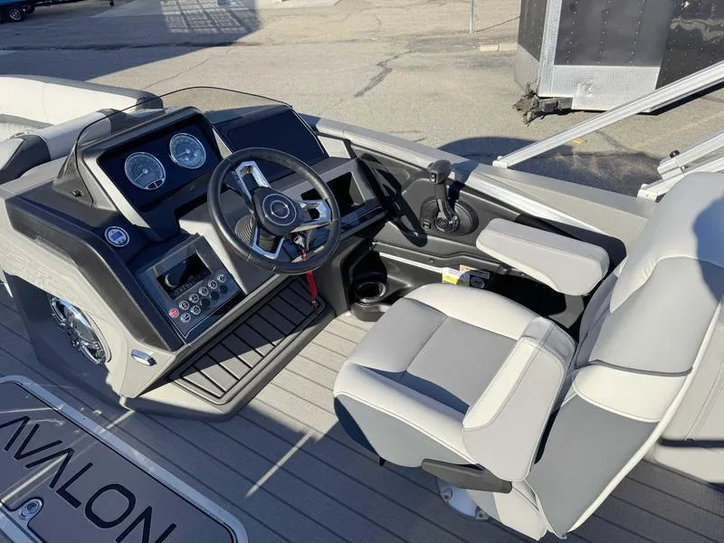 Slide: The Image of 2025 Avalon 2385 25 Catalina VRB boat interior with steering wheel and dashboard. - 9