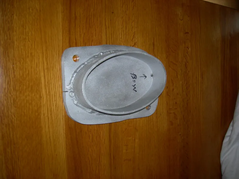 Slide: The Image of 1982 Morgan 32 boat component on wooden surface. - 36