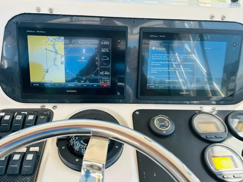 Slide: The Image of Boat dashboard with Garmin GPS displays on a 2002 Grady-White Express 265. - 11
