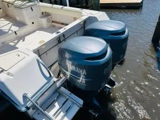 Slide: The Image of 2002 Grady-White Express 265 boat with twin Yamaha outboard engines. - 22