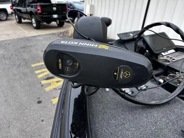 Slide: The Image of Minn Kota Ultrex motor on 2021 Caymas CX 21 boat, parked outdoors. - 11