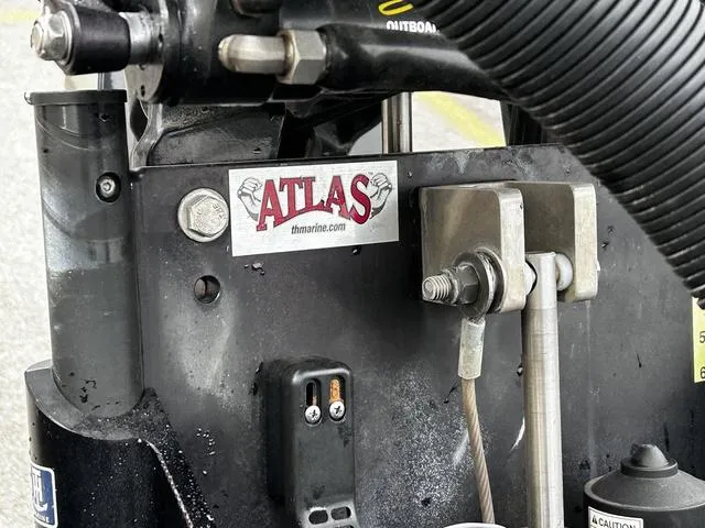Slide: The Image of Close-up of a 2021 Caymas CX 21 boat component with Atlas branding and mechanical details. - 16