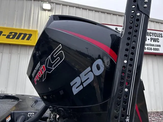 Slide: The Image of 2021 Caymas CX 21 with Mercury Pro XS 250 outboard motor, displayed outdoors. - 3