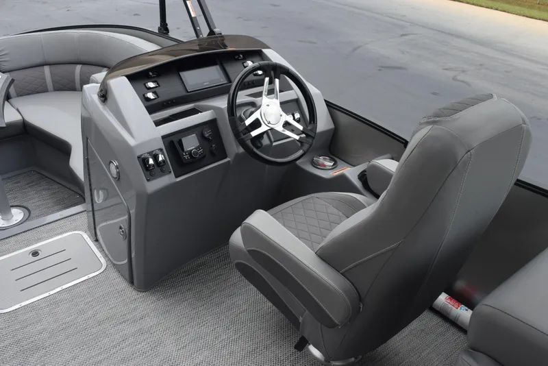 Slide: The Image of 2023 Bennington 23 LTFB boat interior with steering wheel and seating. - 10