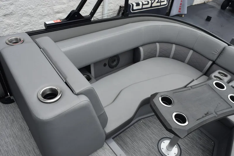 Slide: The Image of 2023 Bennington 23 LTFB boat interior with gray seating and cup holders. - 14