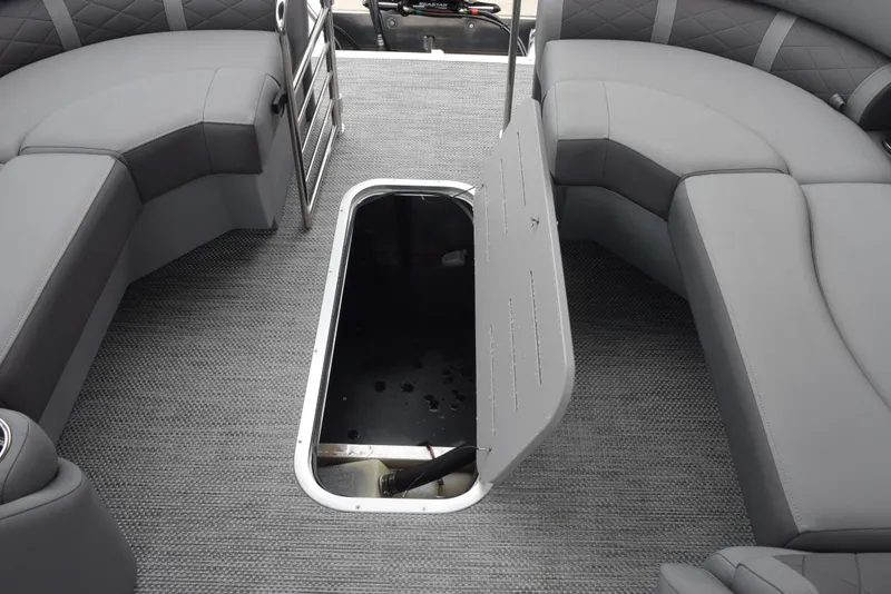 Slide: The Image of 2023 Bennington 23 LTFB pontoon boat interior with open storage compartment. - 17