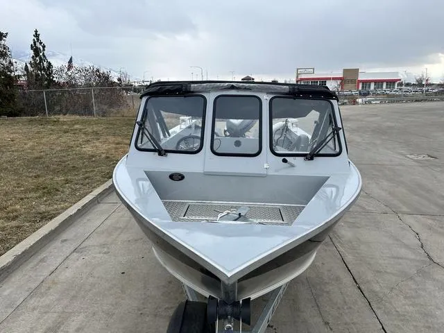 Slide: The Image of 2021 Hewescraft Sportsman 180 SM boat on trailer, parked outdoors. - 5