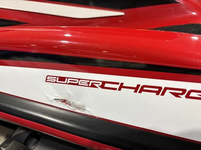 Slide: The Image of 2017 Yamaha WaveRunner GP1800 in red and white, parked indoors on a trailer. - 4