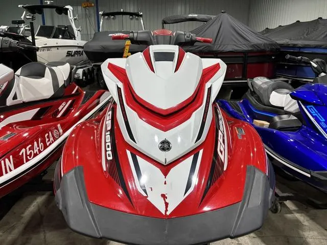 Slide: The Image of 2017 Yamaha WaveRunner GP1800 in red and white, parked indoors among other watercraft. - 5