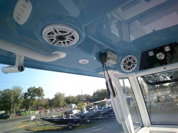 Slide: The Image of Interior view of 2025 Sportsman 247 MASTERS boat, featuring speakers and control panel. - 8