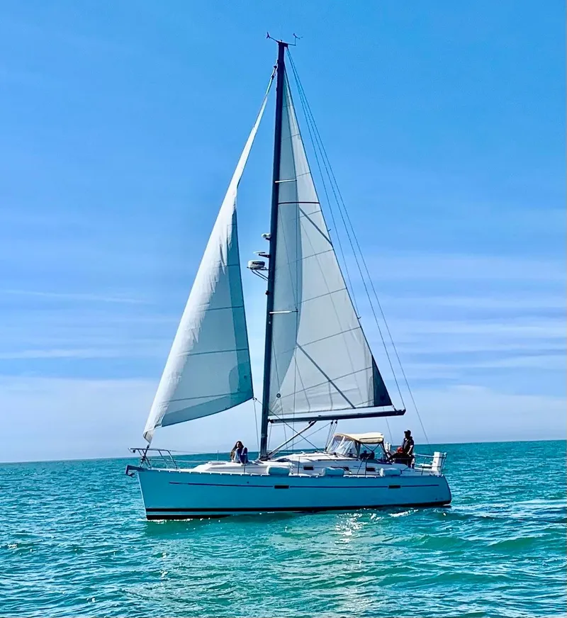 Slide: The Image of 2006 Beneteau Oceanis Clipper 343 sailing on open sea under clear blue sky. - 0