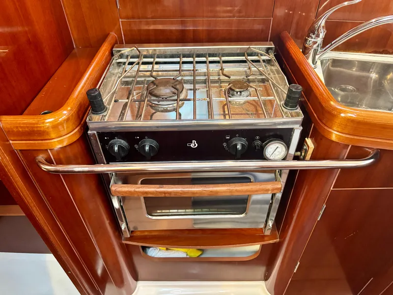 Slide: The Image of 2006 Beneteau Oceanis Clipper 343 yacht kitchen with stove and sink. - 16