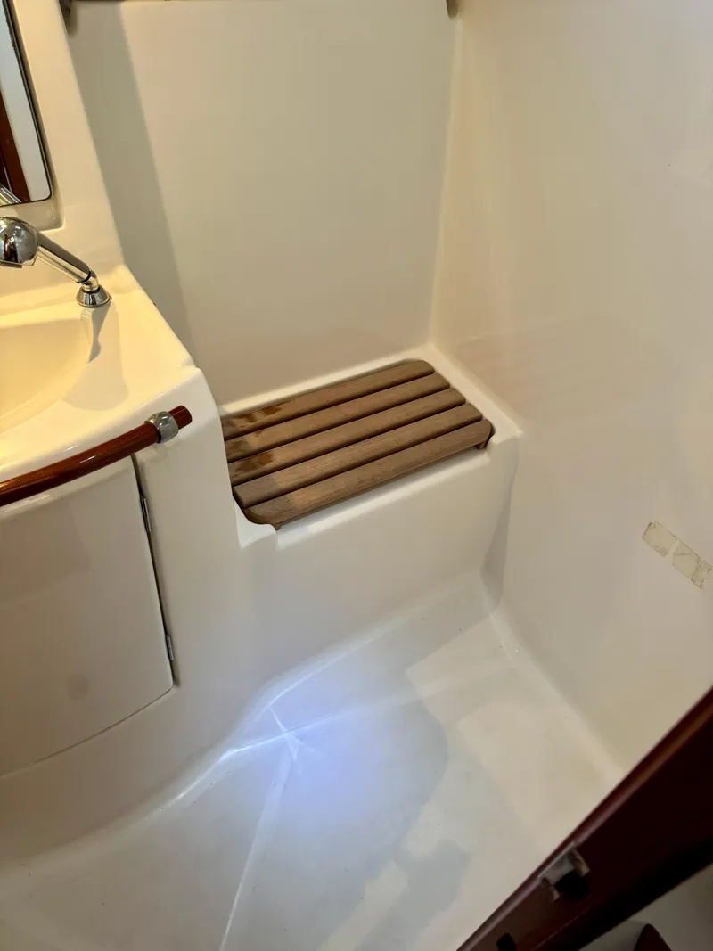 Slide: The Image of Bathroom interior of 2006 Beneteau Oceanis Clipper 343 yacht, featuring a compact shower area. - 20