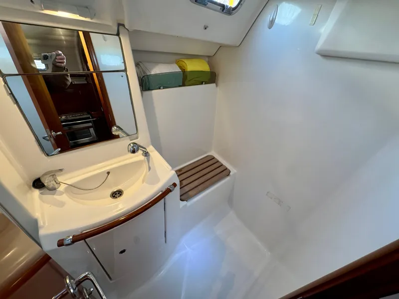 Slide: The Image of Bathroom interior of 2006 Beneteau Oceanis Clipper 343 yacht, featuring sink and mirror. - 22