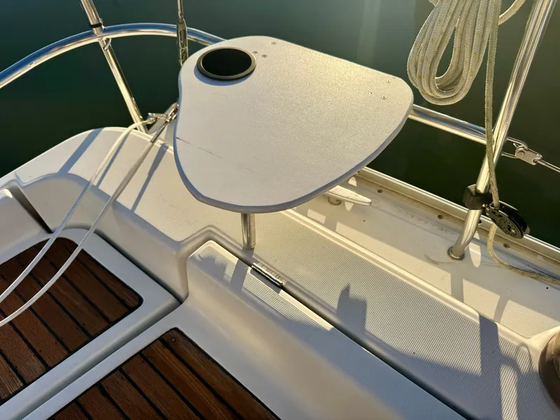Slide: The Image of Beneteau Oceanis Clipper 343, 2006 model, cockpit detail with wooden flooring and table. - 28