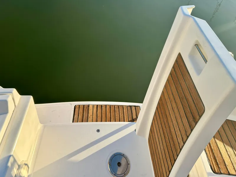 Slide: The Image of Beneteau Oceanis Clipper 343, 2006 model, teak deck detail by the water. - 32