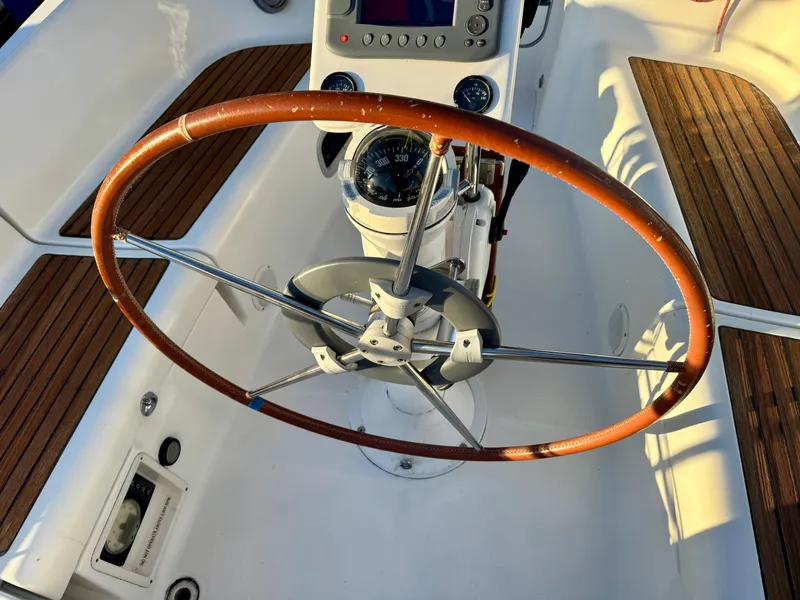 Slide: The Image of Steering wheel of 2006 Beneteau Oceanis Clipper 343 sailboat with wooden accents. - 33
