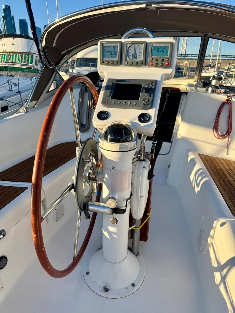 Slide: The Image of 2006 Beneteau Oceanis Clipper 343 cockpit with steering wheel and navigation instruments. - 34