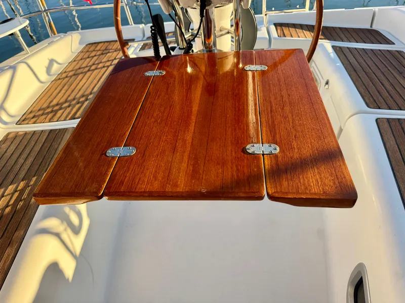 Slide: The Image of Wooden cockpit table on 2006 Beneteau Oceanis Clipper 343 sailboat. - 36
